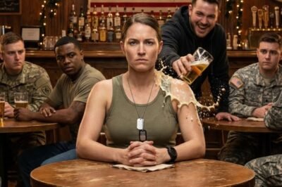 They laughed at him too.  Right up until the bartender froze mid-pour, bottle tilted, eyes locked on the woman now standing by the jukebox, phone pressed to her ear.