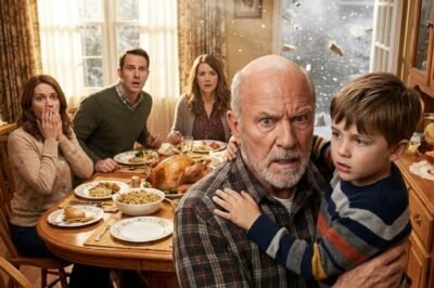 I arrived unannounced on Thanksgiving Day — and found my grandson shivering outside in a T-shirt and shorts while the rest of the family ate turkey in a warm dining room. I put my coat around him, walked to the door… and six words later, their faces went white.